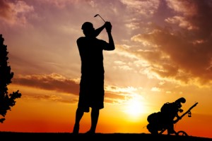 silhouette of a man swinging