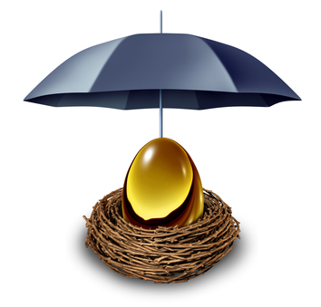 Financial security and retirement fund insurance symbol with a golden egg in a nest protected by a black umbrella against down turns in the economy and as a tax shelter on a white background.