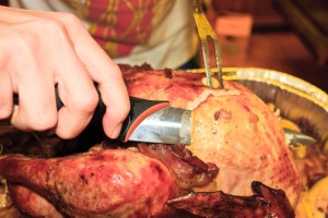 Carving the thanksgiving turkey (close up view)