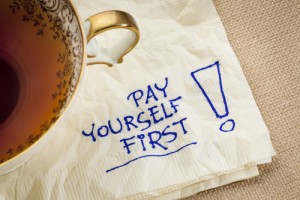 pay yourself first, a reminder of personal finance strategy - a napkin doodle with a tea cup