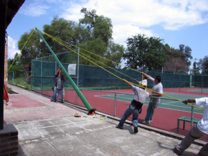 Installing lights on tennis courts, Mexico